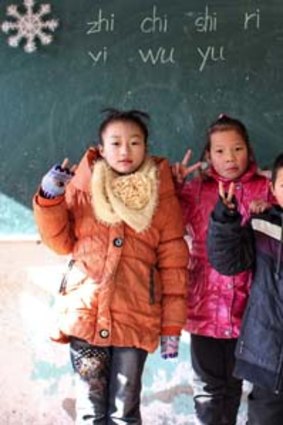 China: Pupils start the day at 7am - by saluting the flag - and finish at 8.30pm, after three hours of supervised homework.