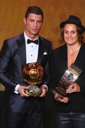Cristiano Ronaldo of Portugal and Real Madrid poses with FIFA Women's World Player of the Year winner Nadine Angerer.