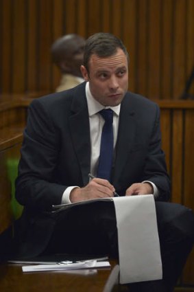 Notes: Oscar Pistorius in court during his trial on Wednesday.