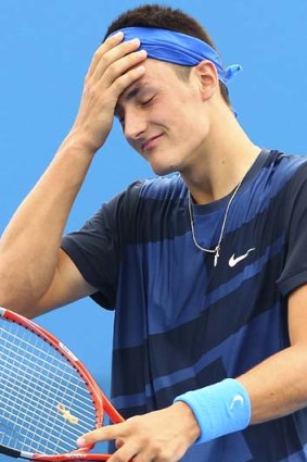 Bernard Tomic reacts after losing his match against Alexandr Dolgopolov of the Ukraine in 2011.