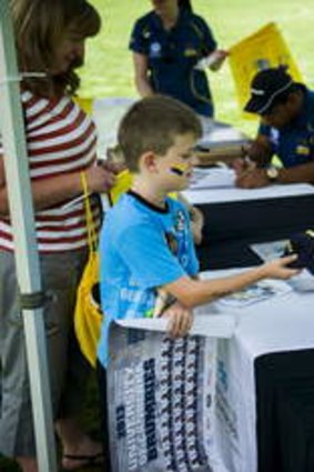 Brumbies fans line up for autographs on Sunday.