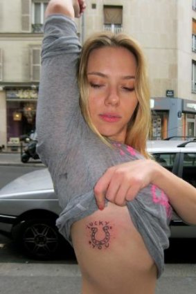 Celebrity ink: Scarlett Johansson shows off her Fuzi tattoo.