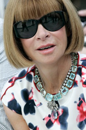 Anna Wintour in those trademark sunglasses.