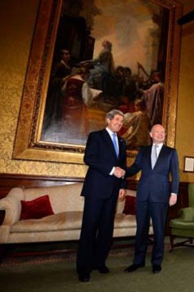 United in their goal: British Foreign Secretary William Hague greets US Secretary of State John Kerry in London.