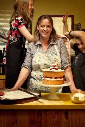 Angela Fleay in the kitchen with her children Matthew and Bridget.