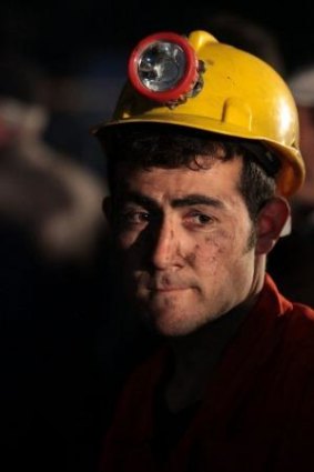 A miner awaits the rescue of trapped friends outside the coal mine in Soma, Turkey.