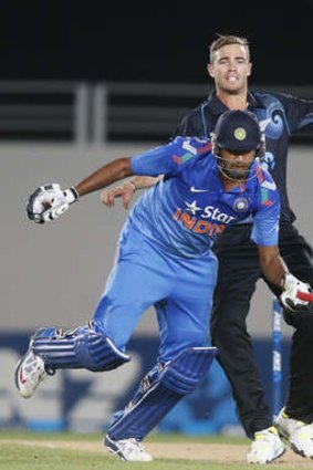 Ravichandran Ashwin (blue) and Tim Southee collide.
