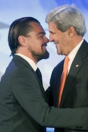 Leonardo DiCaprio greets US Secretary of State John Kerry on stage at the Our Ocean conference.