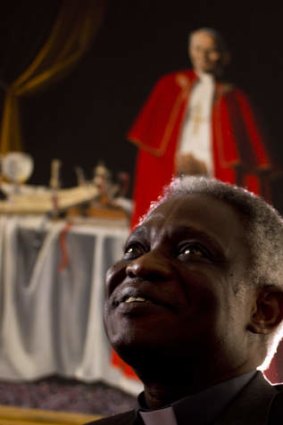 A conservative contender ... One of Africa's brightest hopes to be the next pope, Ghanian Cardinal Turkson, says the time is right for a pontiff from the developing world. In the background is a painting of late Pope John Paul II.