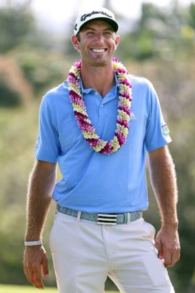 Dustin Johnson smiles after winning the truncated Tournament of Champions.