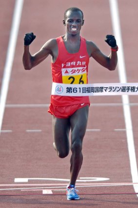 Samuel Wanjiru of Kenya crosses the finish line during the Fukuoka international marathon in 2007.