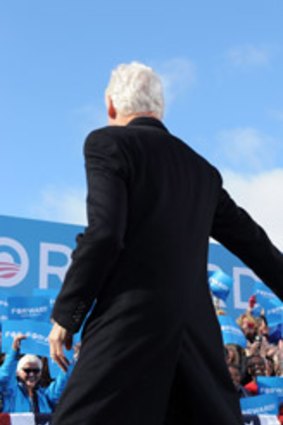 Brothers in arms: President Obama is greeted by former president Bill Clinton in New Hampshire.