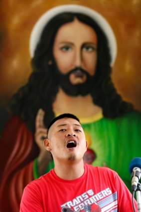 Andrew Chan singing praise during mass.