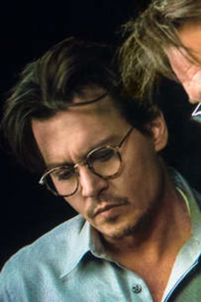 Johnny Depp, on set with Wally Pfister, plays a scientist who uploads his brain to a computer in <i>Transcendence</i>.