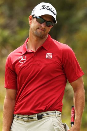 Australia's Adam Scott looks dejected after missing a putt during day three of the World Cup of Golf at Royal Melbourne Golf Course on Saturday.