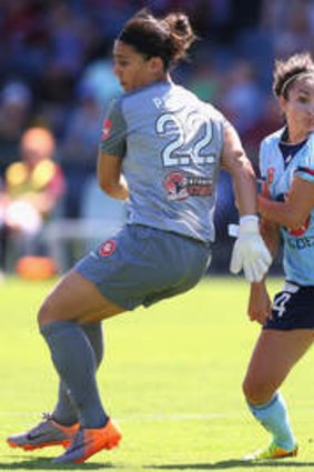 Double delight: Sky Blues striker Jodie Taylor skips past Wanderers keeper Dimitra Poulos in the derby on Sunday.