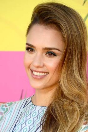 Side part: Give Jessica Alba's hair extra fullness.