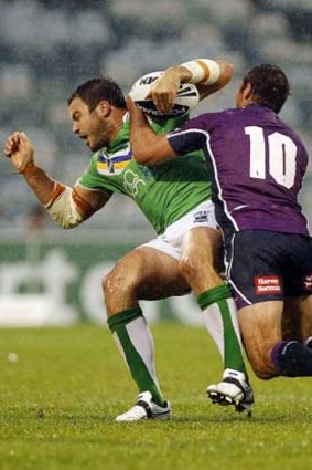 "I feel really energised being injury-free now" ... David Shillington of the Raiders is tackled by Bryan Norrie of the Storm during round 1.