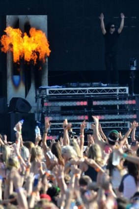 Throw your hands in the air... Skrillex works the crowd at the Future Music Festival.