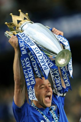 Chelsea captain John Terry celebrates with the Barclays Premier League trophy.