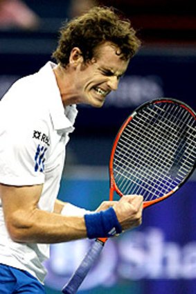 Andy Murray is exultant after winning a point against Roger Federer last night.