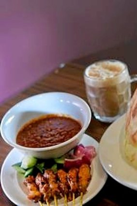 Roti tisu with chicken satay and teh tarik.