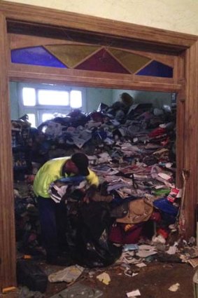 Uninhabitable: The inside of the once-grand Victorian terrace in Arcadia Street, Glebe is piled high with old newspapers, science textbooks and car batteries.