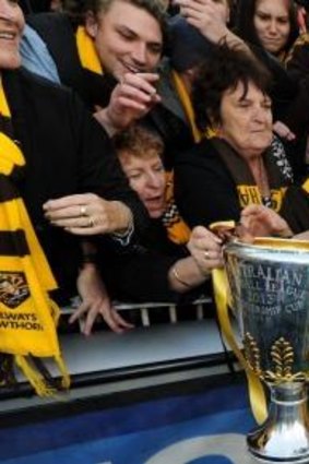 Happy days with the premiership cup and a Norm Smith Medal.