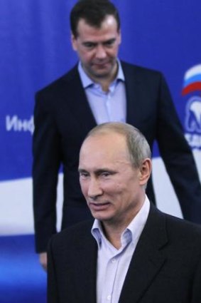 Vladimir Putin (front) and Dmitry Medvedev.