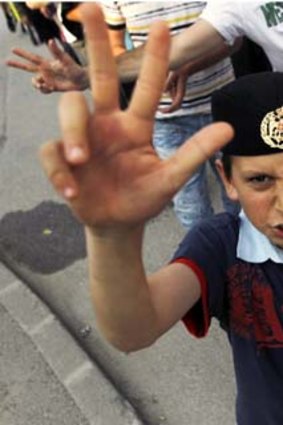 A child gestures during a protest to support wartime General Ratko Mladic in the town of Pale, near the Bosnian capital of Sarajevo.