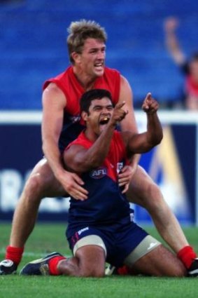 Farmer celebrates a goal with David Schwarz in 2000.