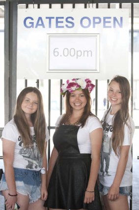 Maddi Best,Jasmine Robinson and Brittney Robinson pose for a portrait at the Brisbane Entertainment Centre hours before One Direction's scheduled performance. 19th of October 2013