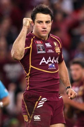 Made up for his game two sin-binning ... Cooper Cronk celebrates after kicking the winning field goal.