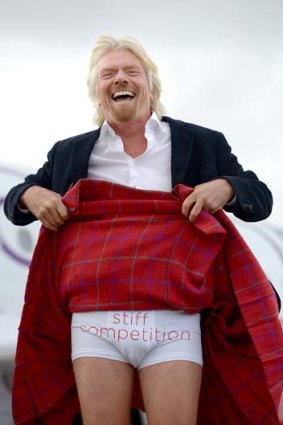 Richard Branson shows of his underwear with a cheeky slogan.