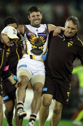 Brent Guerra carried from the field after injuring his knee in round six.