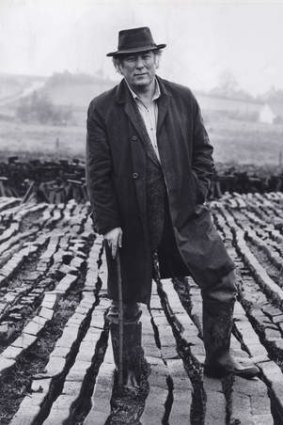 Poet Seamus Heaney pictured in 1987 at his local peat bog, near Bellaghy village, County  Derry, Northern Ireland.
