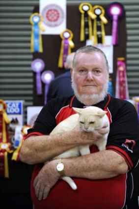 Claws are out ... Brian Edwards, holding Mystyle, defected from Cat Fanciers and established Australian National Cats.