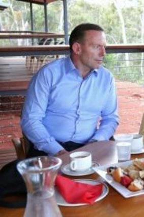 Abbott has a cup of tea with Galarrwuy Yunupungu, leader of the Gumatj clan.