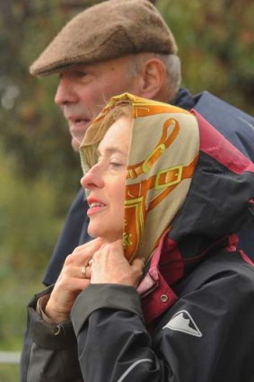 Trainer Gai Waterhouse tries to keep warm after watching Tres Blue at Werribee.