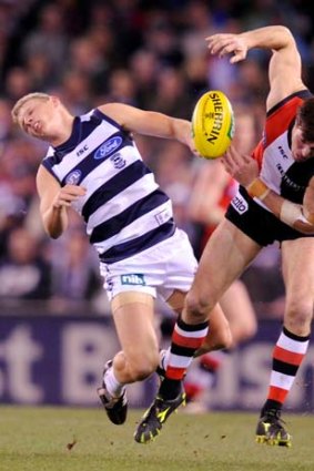 Two worlds colliding: Geelong’s Taylor Hunt and St Kilda’s Lenny Hayes.