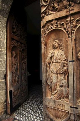 Carved doors at the Lady of Immaculate Conception church in Boac.