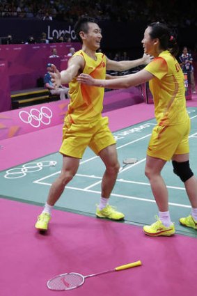 Zhang Nan (left) and Zhao Yunlei celebrate after winning the gold medal match.