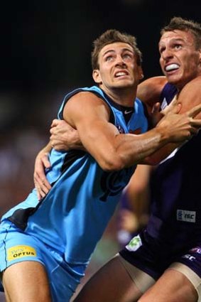 Like a 1950s sci-fi movie poster: Shaun Hampson of the Blues and Jonathon Griffin of the Dockers.