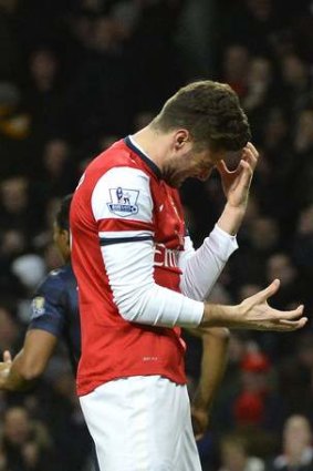 Arsenal's Olivier Giroud shows his frustration after missing a chance against Manchester United.