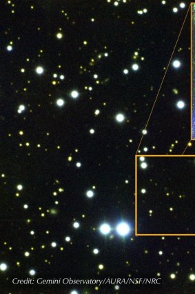A composite image of the field around FRB 121102. The dwarf galaxy from which the fast radio bursts originate is a barely visible green dot.
