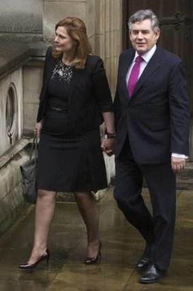 Britain's former PM Gordon Brown and wife Sarah leave the Leveson Inquiry.