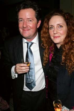 CNN chat-show host and former Daily Mail editor Piers Morgan, seen here with former News of the World editor Rebekah Brooks, has been called back to britain to answer claims he knew about phone hacking.