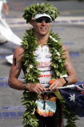 Craig Alexander celebrates after defending his Hawaii Ironman crown in October.