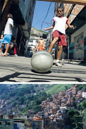 Slum city ...a boy plays football in the favela; (below) Rocinha is only a kilometre from Rio’s famed beaches.
