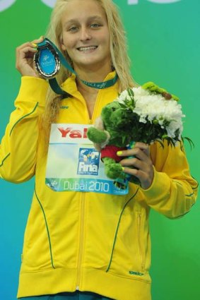 Leiston Pickett of Australia shows off her silver medal from the 50m breaststroke.